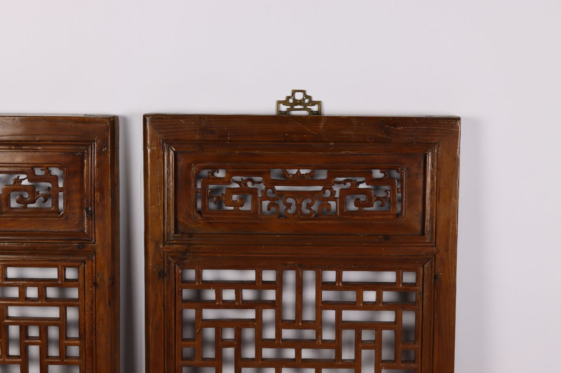 A pair of Chinese fretwork screens with carved motifs. Qing Dynasty, 19th Century - Image 2 of 4