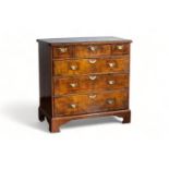 An English George I walnut chest with three short and three long graduated drawers, first half 18th 
