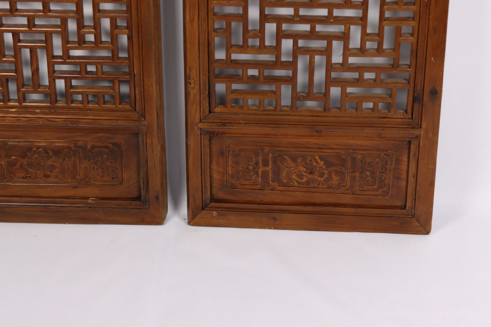 A pair of Chinese fretwork screens with carved motifs. Qing Dynasty, 19th Century - Image 3 of 4