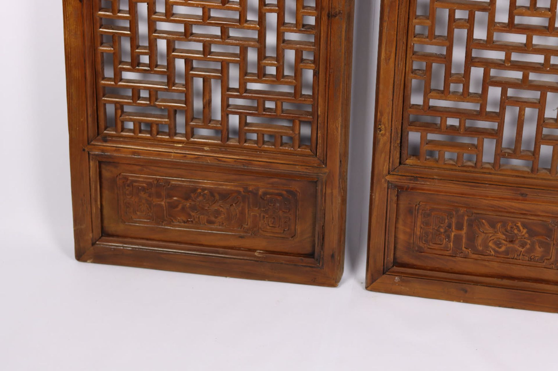 A pair of Chinese fretwork screens with carved motifs. Qing Dynasty, 19th Century - Image 4 of 4
