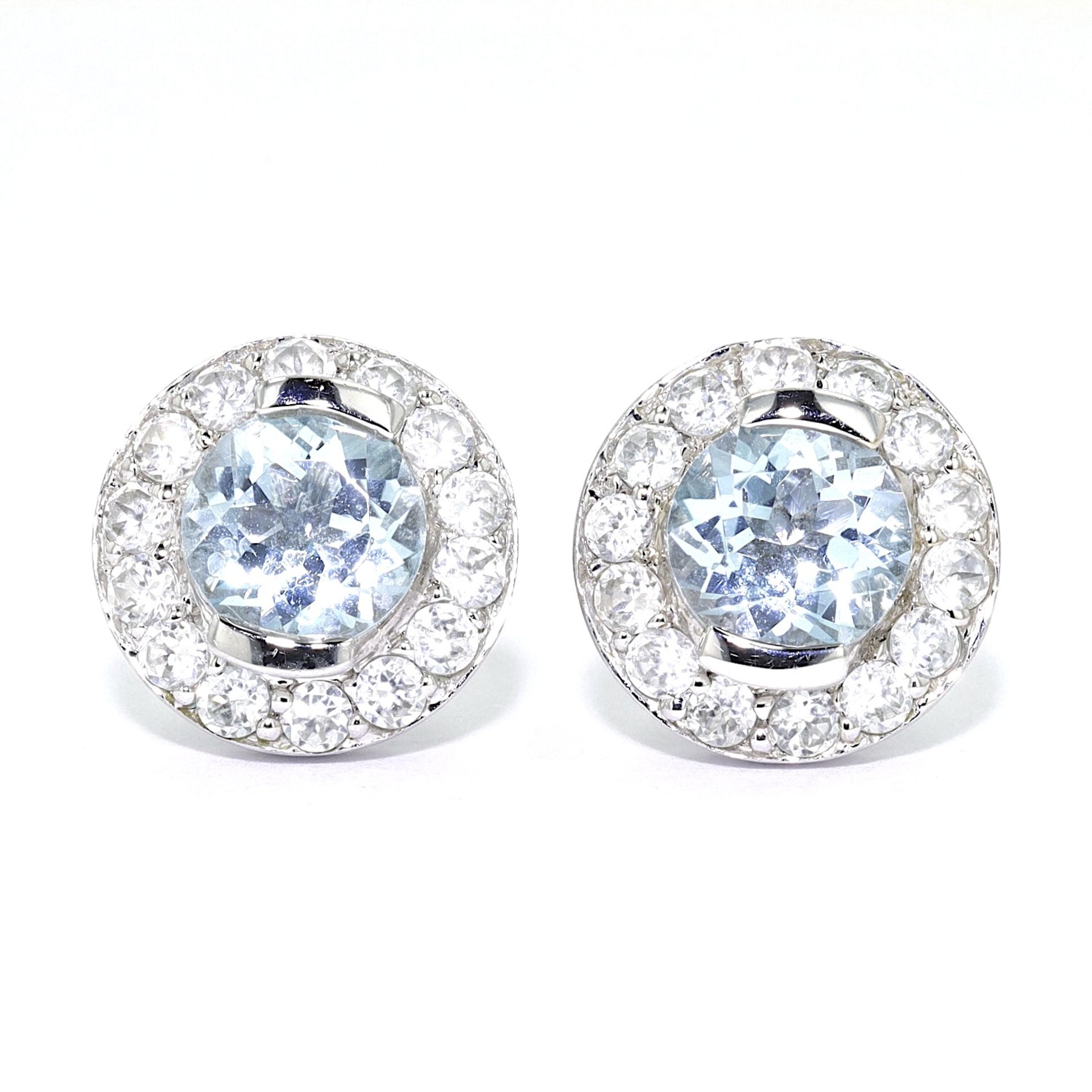 1 pair of stud earrings with topazes and zirconia