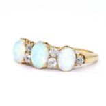 Ring ca. 750 with diamonds and opals