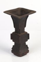 A Chinese bronze gu vase with flared rim, 15cms high. Condition Report upper rim slightly