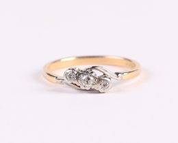 An 18ct gold and three-stone diamond ring, approx UK size J, 1.9g.