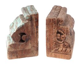 A pair of Indo-Persian carved wood architectural corbels converted into book ends, one having