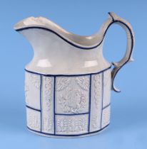 A 19th century English pottery jug decorated in relief with the American Eagle, 12cms high.