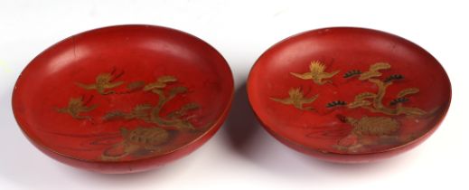 A Japanese Meiji period red lacquer footed bowl and cover, decorated herons and turtles, 12cm