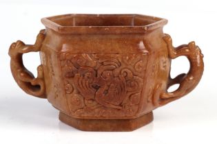 A Chinese carved soap stone censer of hexagonal form decorated dragons and phoenix with monkey