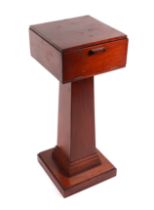 A mahogany plinth with rectangular top on a tapering square column, on a square base, 32cms wide.