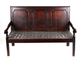 A 19th century oak settle with three panel back on square legs. 146cm wide Condition Report lacks