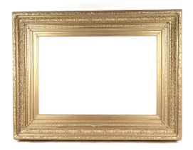 A large carved wood and gesso picture frame, 125cms wide by 100cms deep, image size 90cms wide by