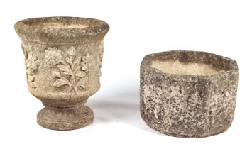 A well weathered reconstituted stone planter, 40cms diameter; together with another similar, 40cms