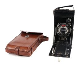 A circa 1960 Kodak Six-16 folding camera with operating instructions and original bill of sale