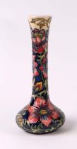 A Moorcroft Pottery Pheasants Eye pattern vase, 21cms high. Condition Report Some crazing