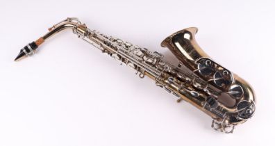 A Buescher Aristocrat 200 alto saxophone with accessories, in a Selmer saxophone hard carry case.