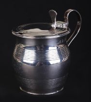 A George III silver mustard pot, London 1811, 9cms high, 140g.