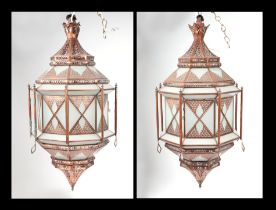 A pair of gilt metal and frosted glass ceiling lanterns in the Moroccan style, each approx 85cms