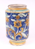 An 18th / 19th century maiolica vase decorated with stylised flowers on a blue ground, possibly 17th