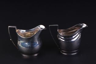 A George III silver cream jug, London 1807; together with another similar, combined weight 226g (