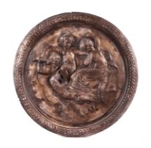 A plaster roundel depicting cherubs riding a swan, 53cms wide.