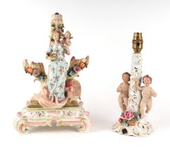 A continental porcelain figural group table lamp, 34cms high; together with another similar, 23cms