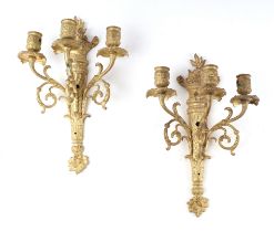 A pair of triple arm gilt metal wall lights, 37cms high (2). Condition Report There are drill