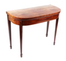 A 19th century mahogany card table on square tapering legs terminating in spade feet, 92cms wide.