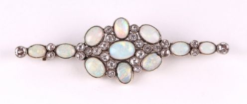 A white metal mounted opal and diamond bar brooch, boxed, overall 6cms wide.