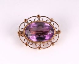 A late Victorian / Edwardian 9ct gold and amethyst brooch, 8g.