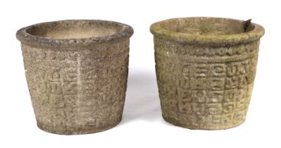 A pair of well weathered reconstituted stone circular planters, 43cms diameter (2).
