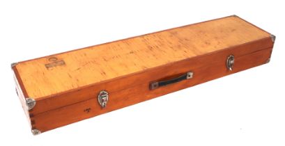 A wooden shotgun case with a selection of gun cleaning kit, 119cms long.
