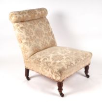 An Edwardian nursing chair with upholstered seat and back, on turned front supports. Condition