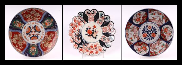 A Japanese Imari pattern charger with scalloped rim, 31cms diameter; together with two similar Imari