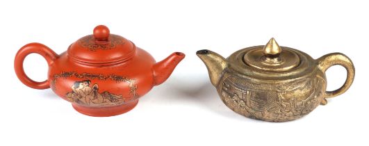 A Chinese Yixing teapot decorated with erotic scenes, character mark to base; together with a gilt