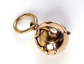 A 9ct gold mounted Masonic ball fob with silver gilt interior, 7.1g.