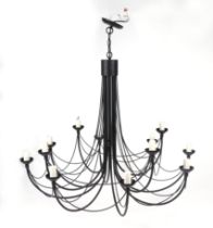 A large painted metal twelve-branch ceiling light, 99cms wide.