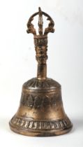 A Tibetan gilt metal hand bell, 16cms high.