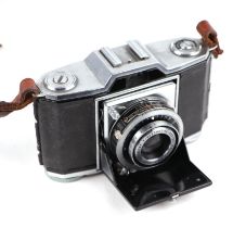 A Zeiss Ikon bellows camera in a leather case.