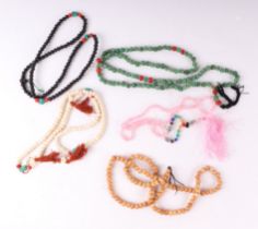 A quantity of hardstone and glass bead necklaces.