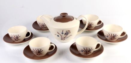 A mid century Poole Pottery part tea service decorated with stylised flowers.