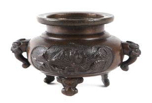 A Chinese bronze censer of squat ovoid form with dog of fo mask handles, 10cms wide.