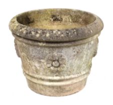 A large reconstituted stone planter, approx 56cms diameter.