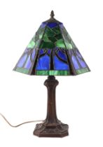 A Tiffany style bronzed spelter table lamp, 54cms high.