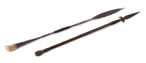 An African Zulu tribal leaf form spear head, 73cms long; together with another similar, 67cms
