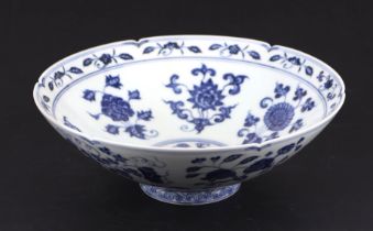 A Chinese blue & white bowl decorated with flowers and fruit, six character blue mark to the