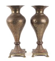 A pair of large Persian / Indian brass vases, 48cms high.