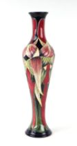 A Moorcroft Pottery Trinity pattern vase, 31cms high. Condition Report Good condition with no damage