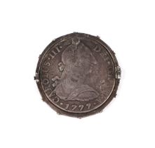 A George III Mexican 1777 8 reals with countermark, in a silver mount.