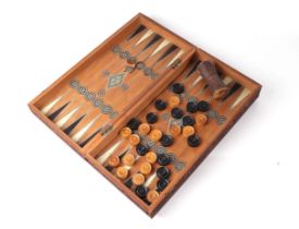 An Anglo-Indian carved sandalwood backgammon case with inlaid decoration, internal backgammon