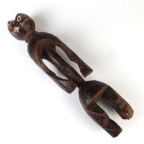 A carved wooden tribal twin headed figure, Mumye Lagalagana, 40cm high